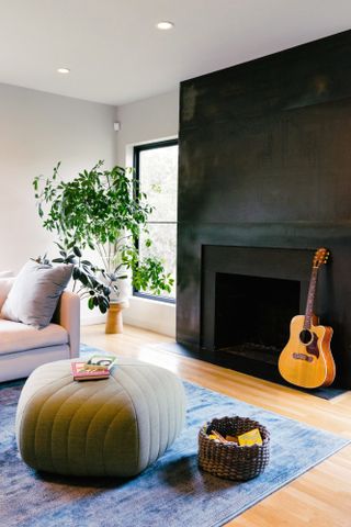 Living room with steel-clad fireplace wall