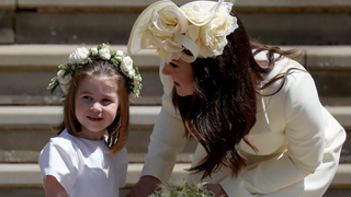 Princess Charlotte of Cambridge stands on the steps with her mother Catherine, Duchess of Cambridge after the wedding of Prince Harry and Ms. Meghan Markle at St George's Chapel at Windsor Castle on May 19, 2018 in Windsor, England