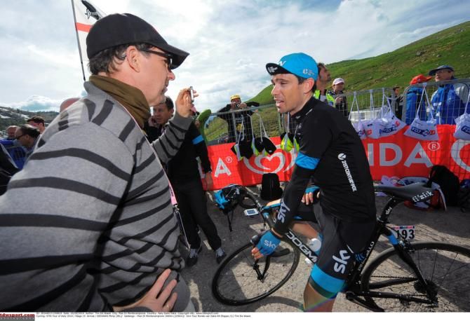 Philip Deignan (Team Sky) quickly changes his helmet for a cap