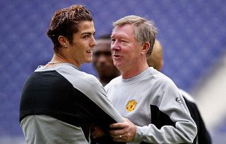 Manchester United manager Sir Alex Ferguson (R) with Manchester United's striker Cristiano Ronaldo (L) at the training session at the Dragon stadium in Porto 24 February 2004. The training session is a day a head of the clash between FC Porto and Manchester United for the UEFA Champoins League first group, knock out round, first leg.