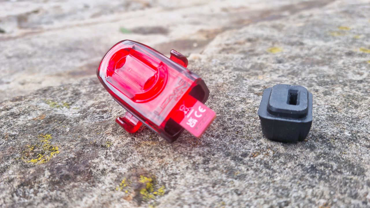 The Lezyne KTV Drive Pro+ dismantled, showing the USB charging bung