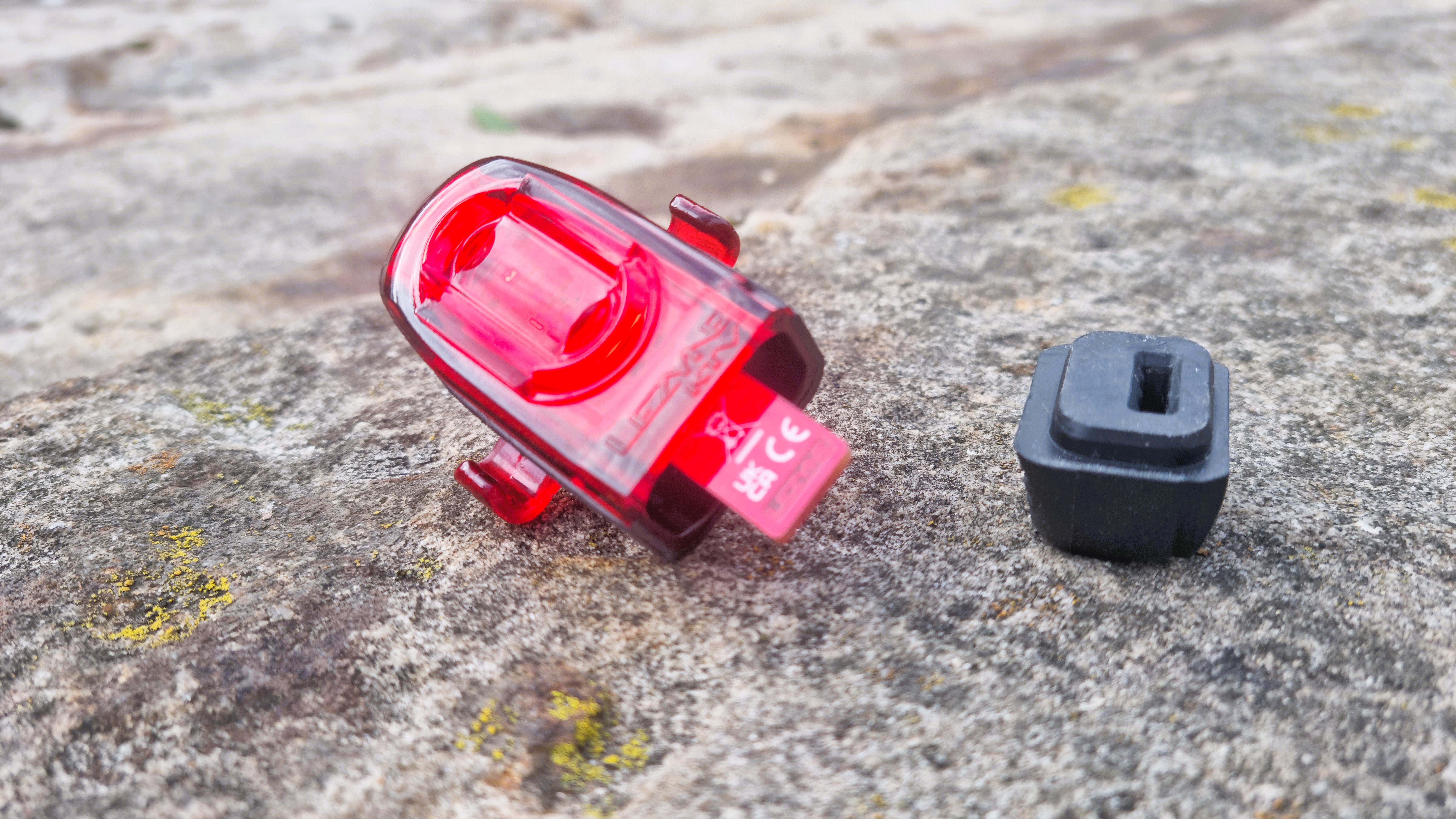 The Lezyne KTV Drive Pro+ dismantled, showing the USB charging bung