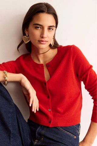 woman wearing red cropped cardigan