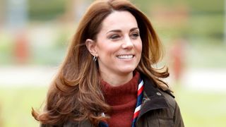 head shot of kate middleton walking outside demonstrating the oval layer haircut