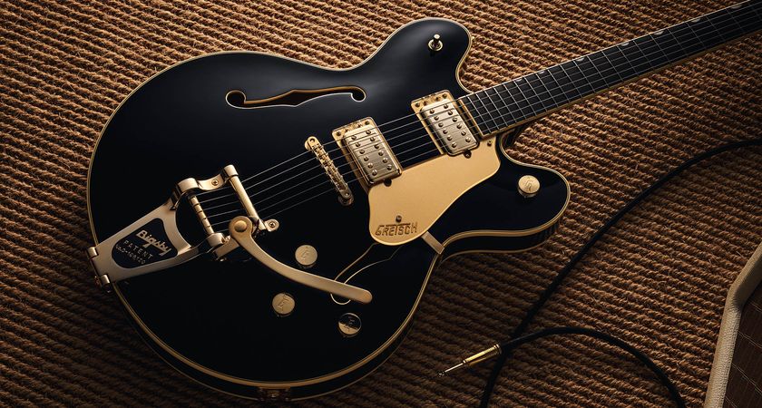 Gretsch Professional Collection Broadkaster LX Center Block: the handsome semi-hollow is finished in black with gold hardware and here is photographed in close-up.
