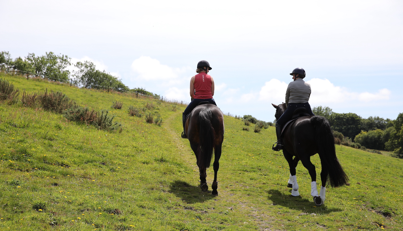 Two riders out hacking. Horse riding for pleasure is good way to build confidence