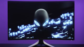 Alienware curved gaming monitor on a purple background 