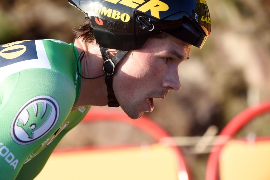 Team Jumbo rider Slovenias Primoz Roglic competes during the 13th stage of the 2020 La Vuelta cycling tour of Spain a 337km individual timetrial from Muros to Mirador de Ezaro Dumbria on November 3 2020 Slovenian Primoz Roglic claimed victory in the Vuelta a Espana time trial on today to regain the lead in the overall classification Roglic took back the red jersey from Ecuadors Richard Carapaz while Britains Hugh Carthy sits third ahead of the races climax on November 1 2020 Photo by MIGUEL RIOPA AFP Photo by MIGUEL RIOPAAFP via Getty Images