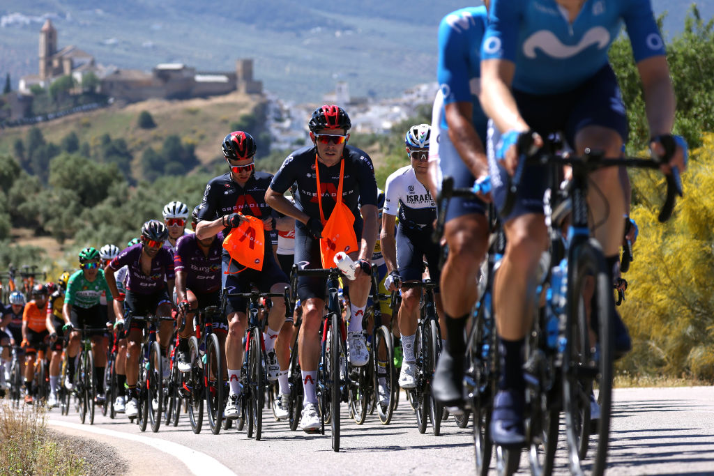 ALCALA LA REAL SPAIN MAY 19 Owain Doull of United Kingdom and Team INEOS Grenadiers Luke Rowe of United Kingdom and Team INEOS Grenadiers the peloton passing Iznajar Village landscape during the 67th Vuelta A Andalucia Ruta Del Sol 2021 Stage 2 a 183km stage from Iznajar to Alcal la Real 1028m Feed Zone VCANDALUCIA on May 19 2021 in Alcala la Real Spain Photo by Gonzalo Arroyo MorenoGetty Images