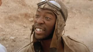 Shaun Parkes looks up with concern in conversation in The Mummy Returns,