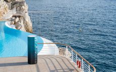 Octagon-shaped gym cabinet by Cassina with Technogym, photographed on the pool terrace by the sea at Hotel du Cap Eden Roc
