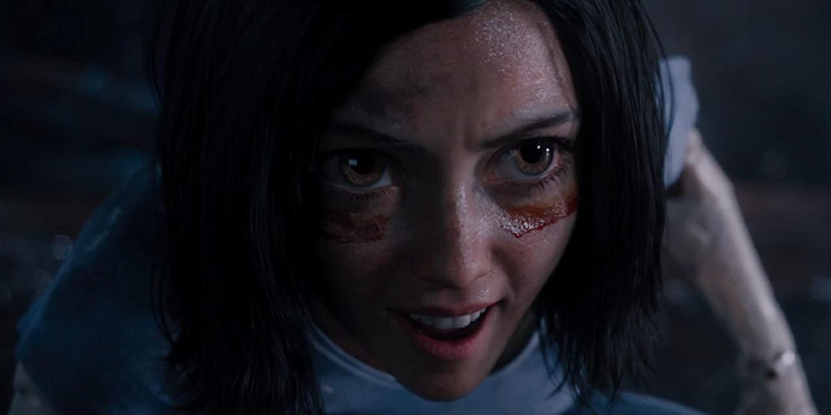 Alita: Battle Angel with war paint and an angry face