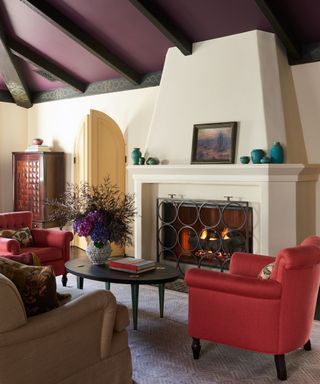 Spanish Colonial living room with wooden ceiling beams and an original fireplace