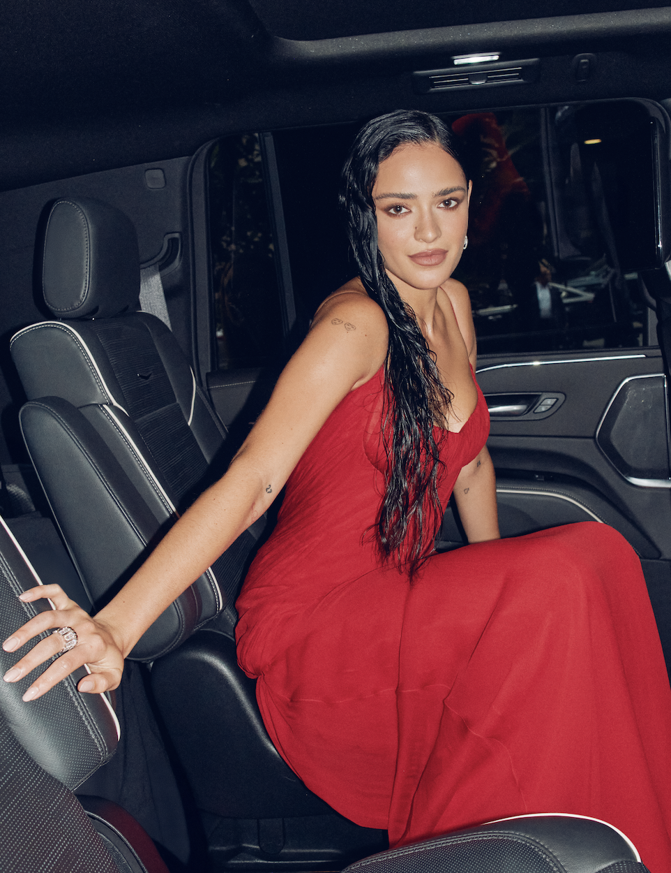 Luna Blaise in red vintage Versace at the Jurassic World Rebirth premiere