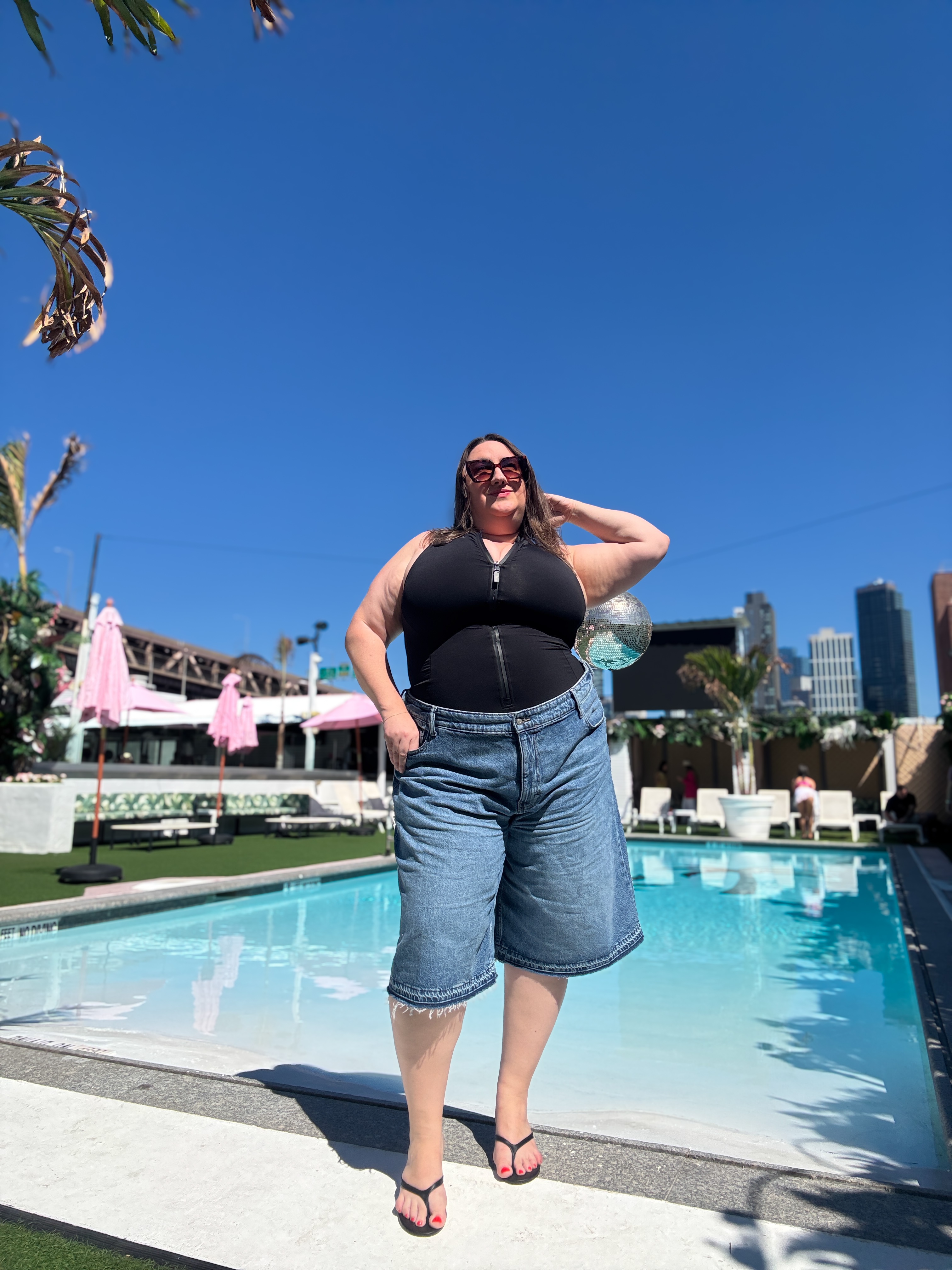 Sarah Chiwaya styling Bermuda shorts and a swimsuit for a special summer occasion