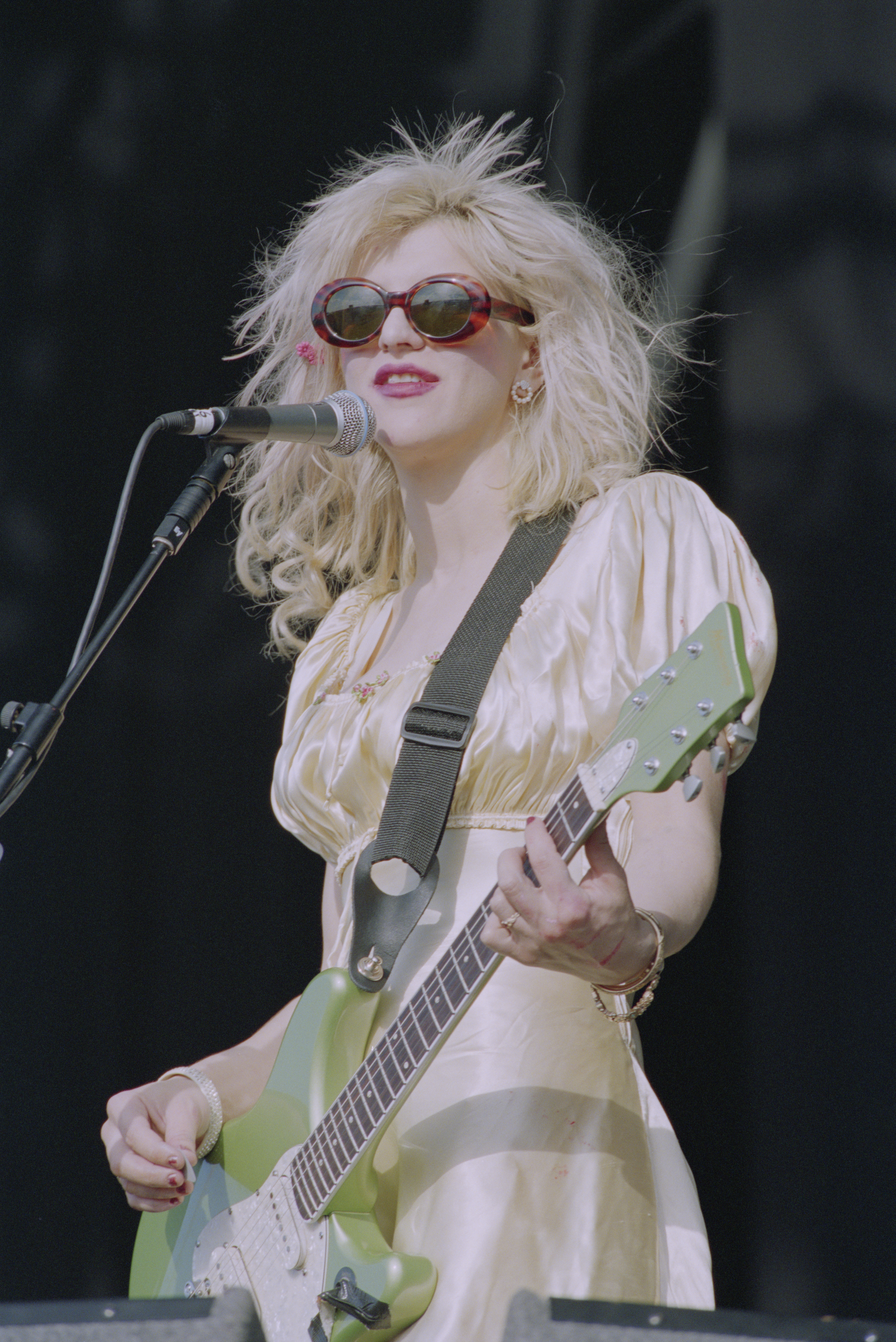 An image of Courtney Love wearing a babydoll dress.