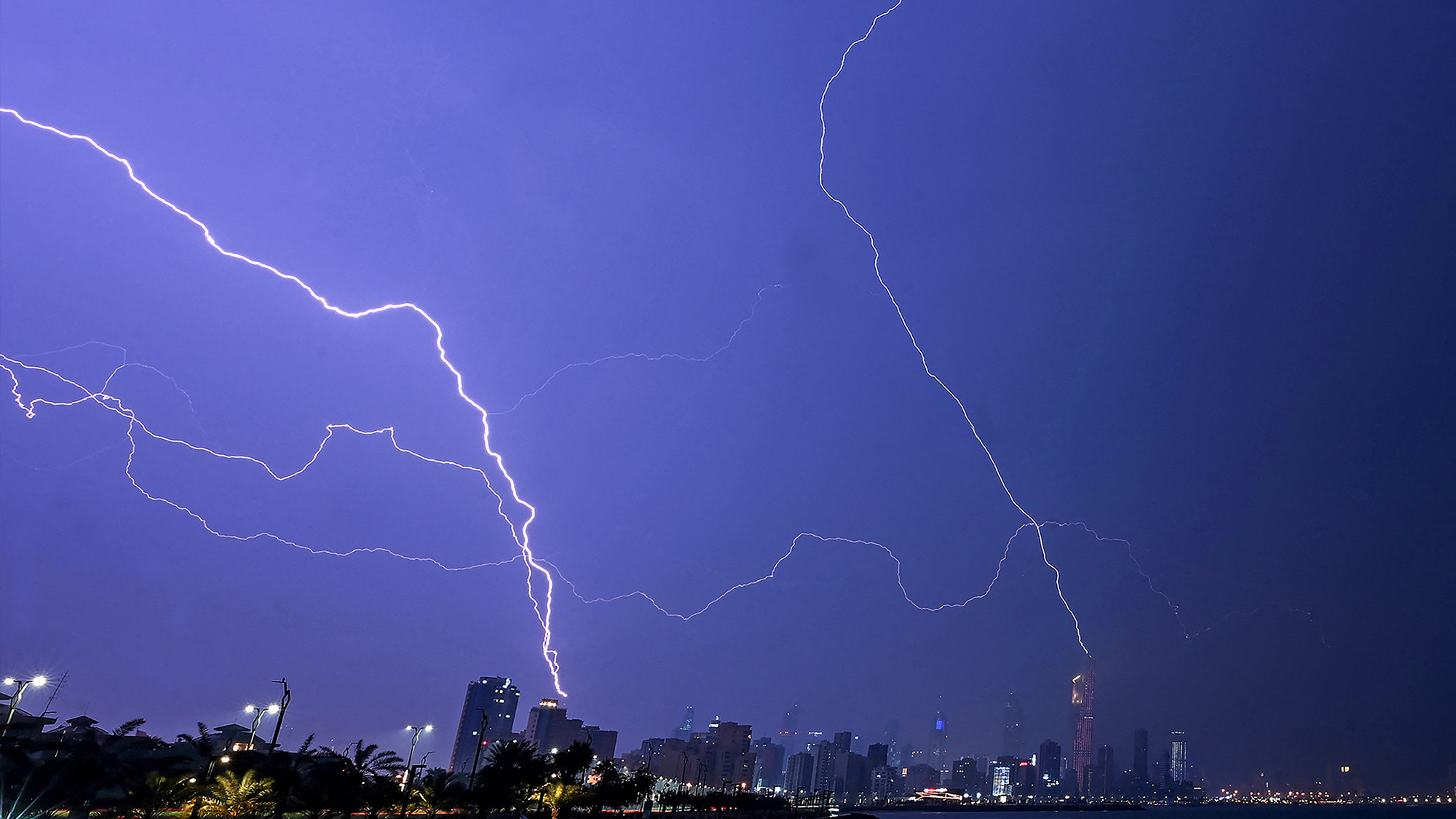 Lightning strikes light up the sky during a thunderstorm in Kuwait City, Kuwait