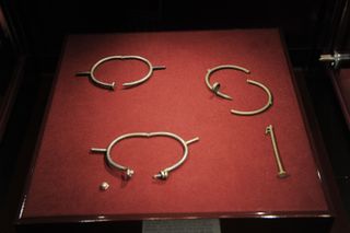 Cartier Juste Un Clou bracelets on display at a museum