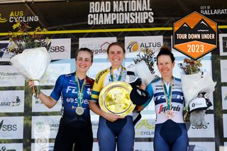 The podium of the women's elite road race at the AusCycling National Championships 2023, with Brodie Chapman (Trek-Segafredo) on the top step, Grace Brown (FDJ-Suez) second and Amanda Spratt (Trek-Segafredo) third