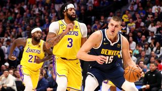  Nikola Jokic #15 of the Denver Nuggets drives against Anthony Davis #3 of the Los Angeles Lakers at Ball Arena 