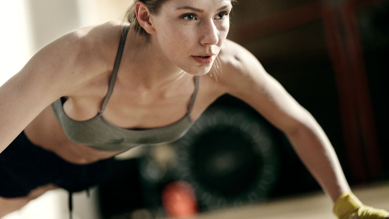 Woman performs a push up