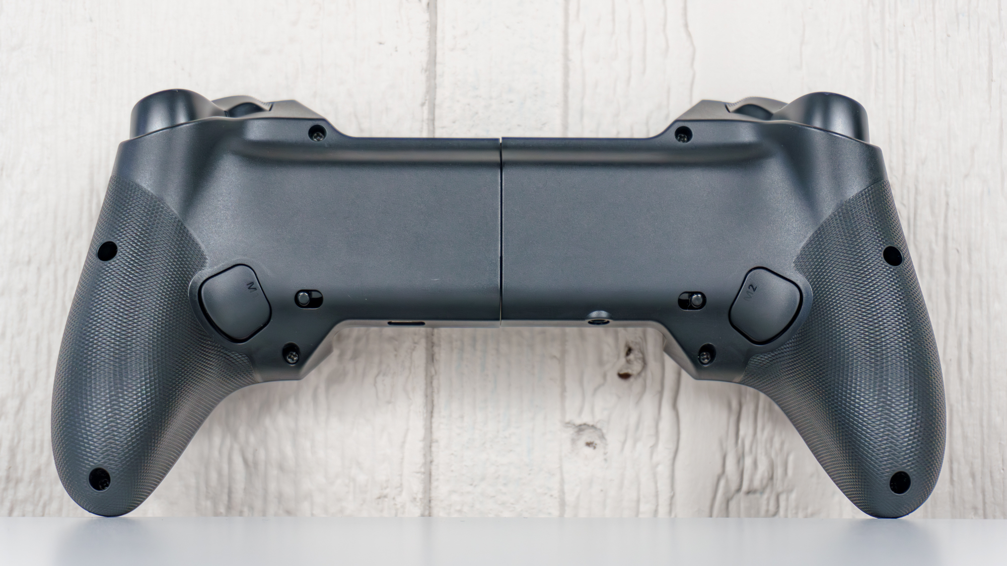 The backside of the Elo Vagabond mobile game controller showing off its remappable back buttons and the textured grips on its handles
