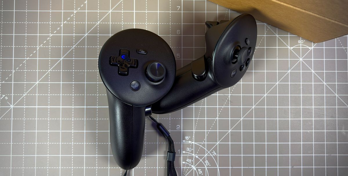 The left and right Steam Frame controllers next to the Steam Frame box.