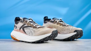the keen seek trail shoes in brown, black, and beige photographed against the blue tom's guide background