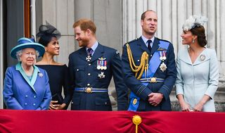 Queen Elizabeth ll, Meghan, Duchess of Sussex, Prince Harry, Duke of Sussex, Prince William, Duke of Cambridge and Catherine, Duchess of Cambridge stand on the balcony of Buckingham Palace.