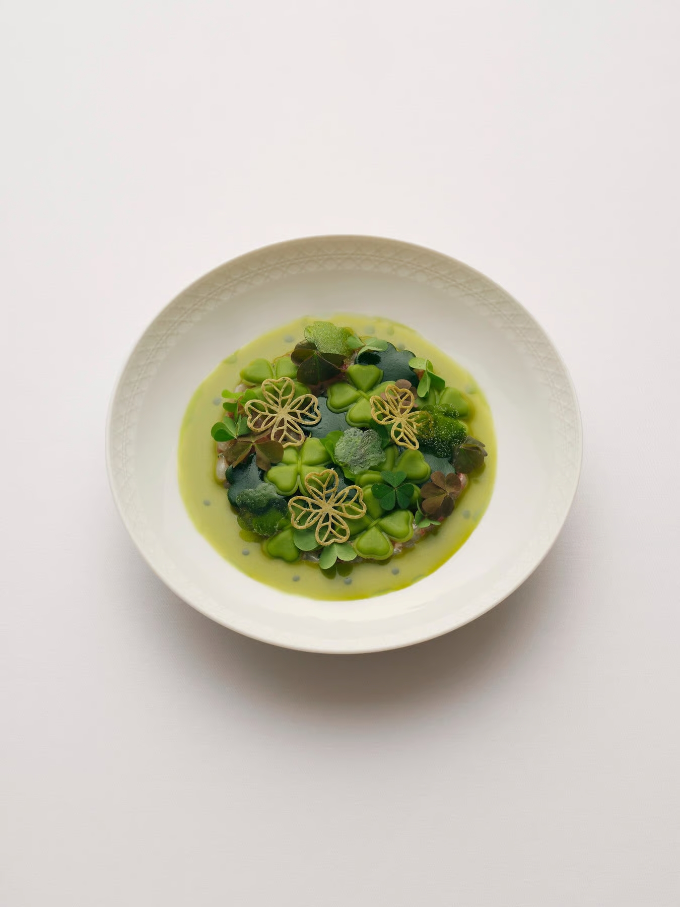 view of some of the dishes at monsieur dior restaurant by mauro colagreco