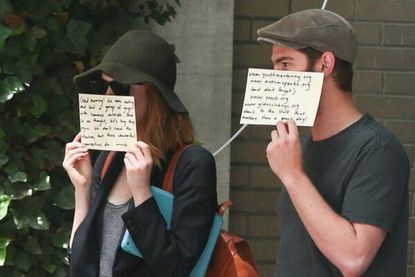 Emma Stone and Andrew Garfield demonstrate the perfect way to deal with paparazzi
