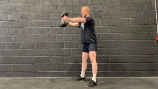 TechRadar fitness writer Harry Bullmore demonstrating a dumbbell swing