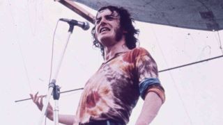 Joe Cocker performing onstage at the Woodstock Festival in 1970