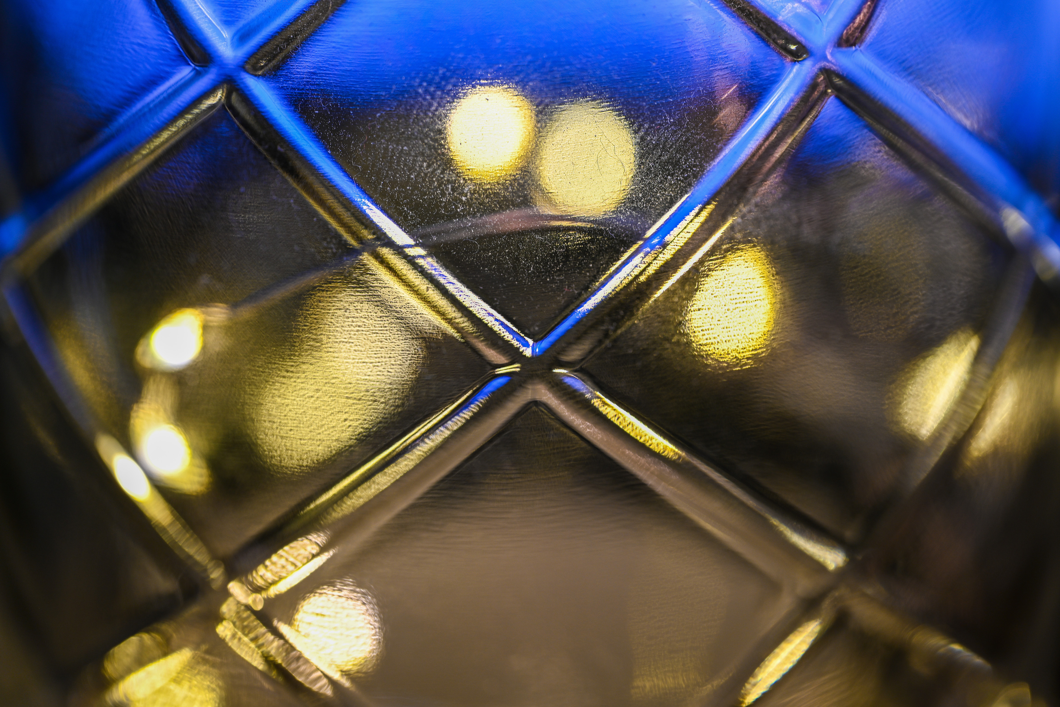 Close-up of a glass bottle and light bokeh