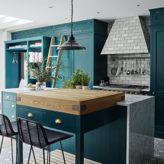 green kitchen with ladder