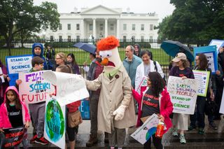 Members of the Union for Concerned Scientists pose for photographs with Muppet character Beaker in front of The White House before heading to the National Mall for the March for Science on April 22, 2017, in Washington, D.C.