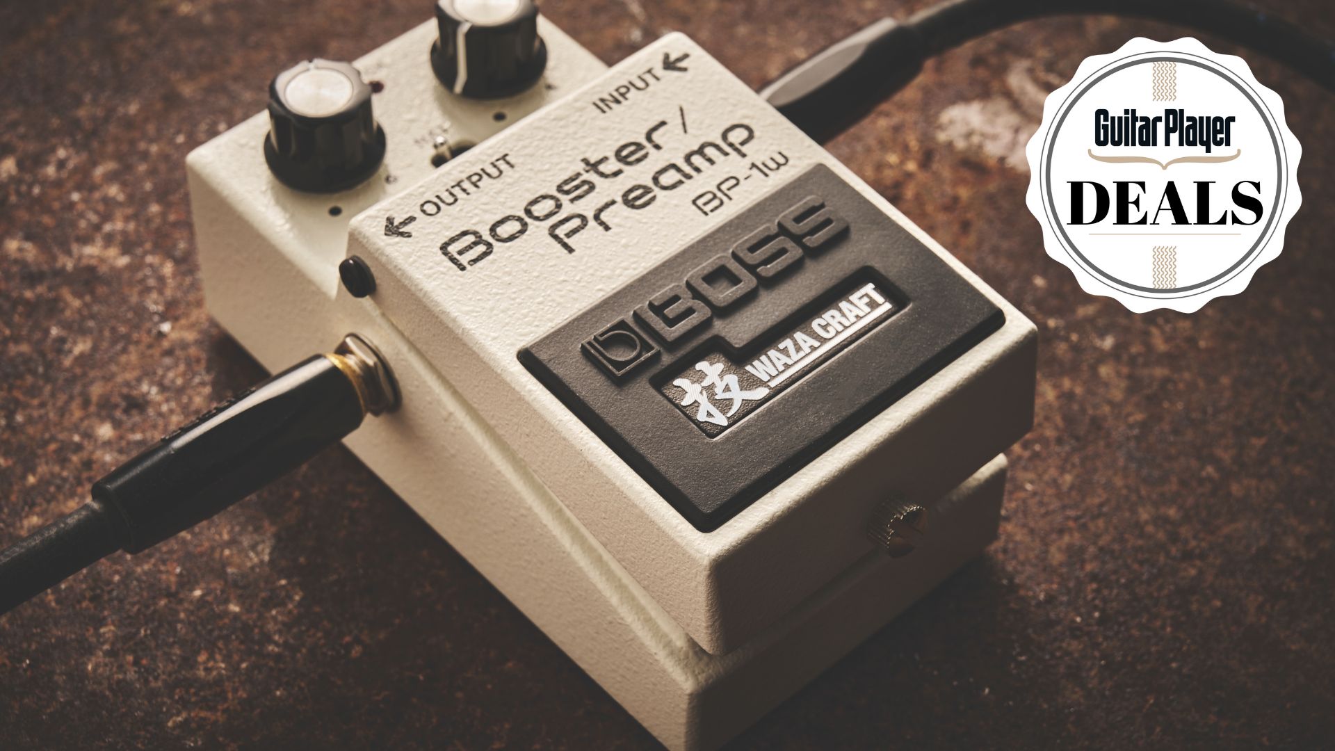 A Boss Booster/Preamp guitar pedal on a distressed floor