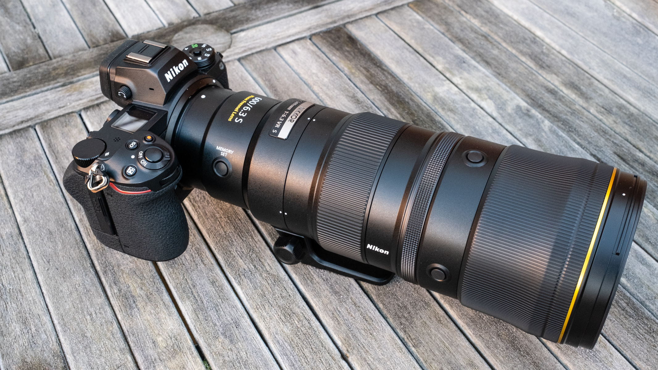 Nikkor Z 600mm f/6.3 VR S  attached to a Nikon Z 7II on a frosty wooden table