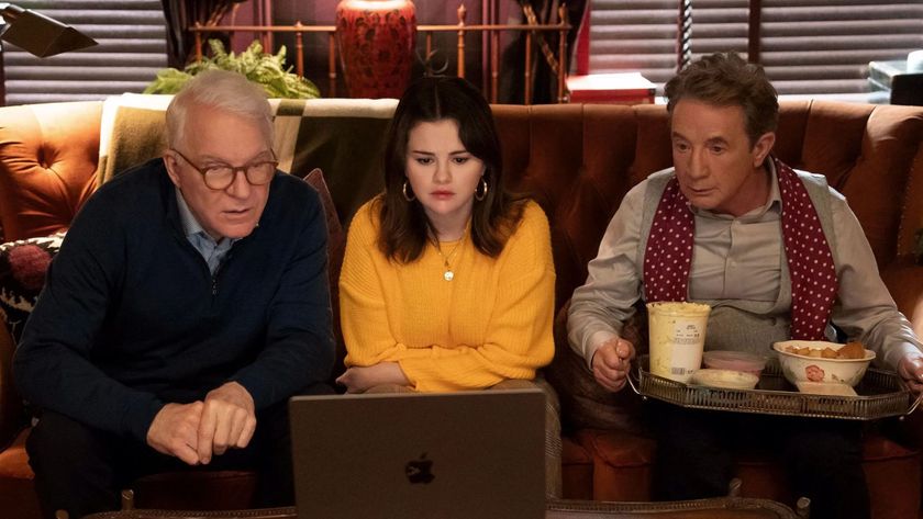 Steve Martin, Selena Gomez and Martin Short sit on a couch looking at a laptop, with a tray of food on Short&#039;s lap