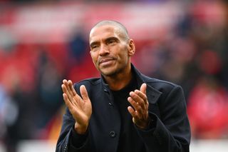 Stan Collymore applauds the fans during a match between his former club Nottingham Forest and Everton in 2023.