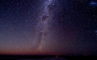 The Milky Way shines in all its majesty, as well as the Magellanic Clouds on the right. at the European Southern Observatory's Very Large Telescope.