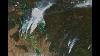 Wildfires in the Canadian province of Manitoba as captured by the NASA satellite Aqua on May 18.