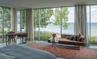 Floor-to-ceiling windows provide the bedrooms with stunning panoramic lake views