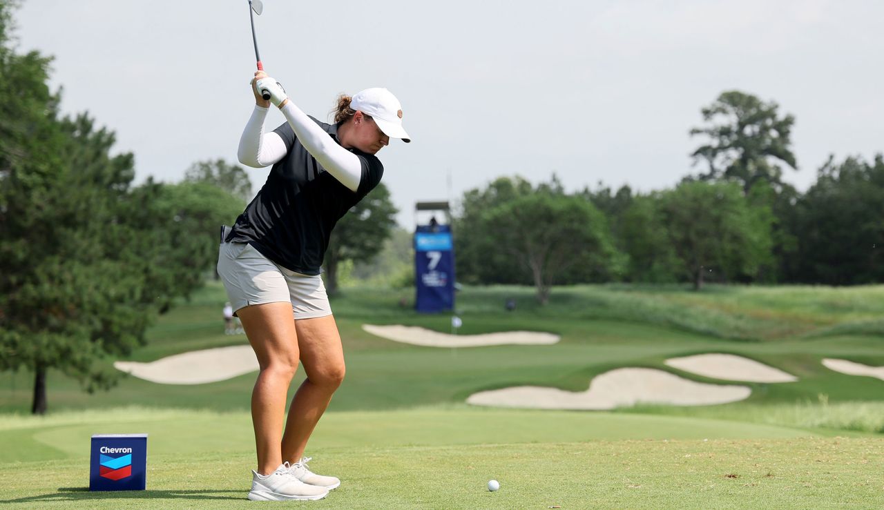 Lauren Coughlin strikes her iron shot at the Chevron Championship