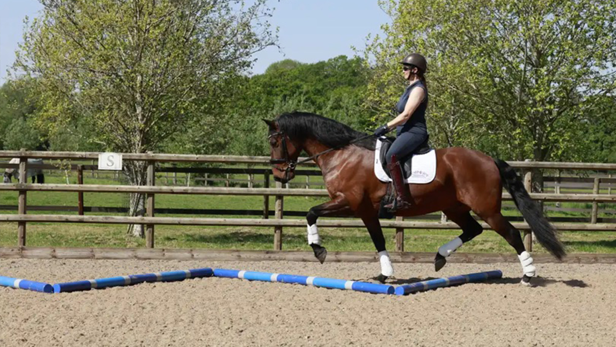 Tania demonstrating how to ride over the zig-zag polework layout