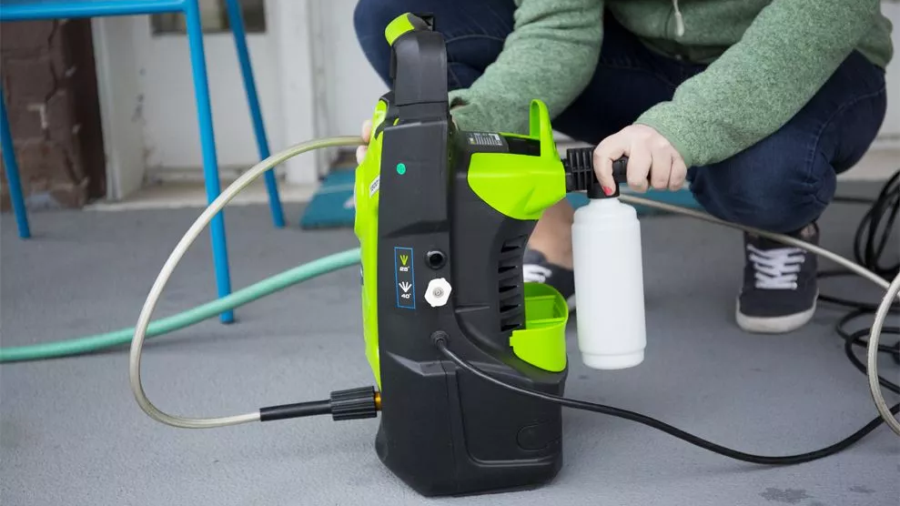 Attaching the soap nozzle on the back of the Greenworks GPW1501
