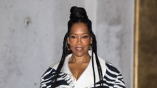 Regina King wearing a high bun hairstyle
