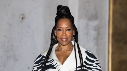 Regina King wearing a high bun hairstyle