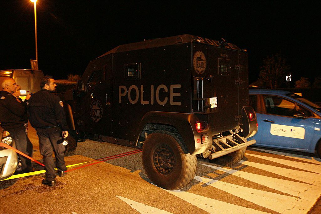 French police respond to the murder of two police officials outside Paris