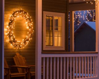 glowing Christmas wreath on porch